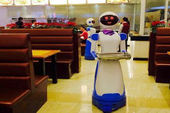 Pic shows: This restaurant has robot as waiters. A Chinese restaurant owner inspired by the restaurant Bots from the hit US show Sam and Cat has created a restaurant filled with robots. The robot restaurant on the TV show features robot waiters like Tandy and Bungle, and now a restaurant in Ningpo, a seaport city in north-eastern China's Zhejiang province, has also taken on robot staff. Although wages for the robots in the city's Liancheng shopping mall are non-existent, they still do not come cheap at around 6,000 GBP each. But with a five-year-warranty on each robot, and the fact that they only need to be charged four-hours-a-day, the owner Lu Dike, 48, reckons in the long-term it is going to save a fortune on wage bills. And the robots have not just been popular with fans of the US series, but also with people who have not even seen the show and want to experience being serviced by robot staff. The "waiters" navigate their way around with the use of an optical sensing system, enabling them to independently serve food to any table within the restaurant. Additionally, the robots have the capability to speak up to 40 phrases in Mandarin Chinese, such as "enjoy your meal". And restaurant owner Dike is even being pressured now to put the robots on sale for people to take home. He said: "I get asked at least once a day if I'm prepared to sell one of them, who knows, maybe it might be a good sideline." One of those who wants to buy one was customer Xu Yuan, 34, who said: "I really like the service and I think I would really like one at home, my son has been pestering me ever since we came here for a snack after a trip to the movies." (ends)